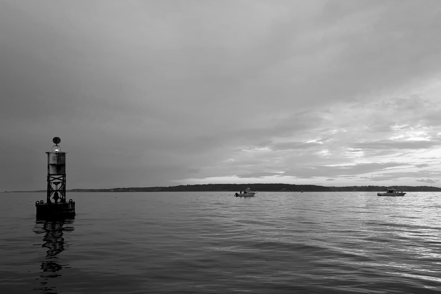 Channel buoy at dusk off the Maine coast